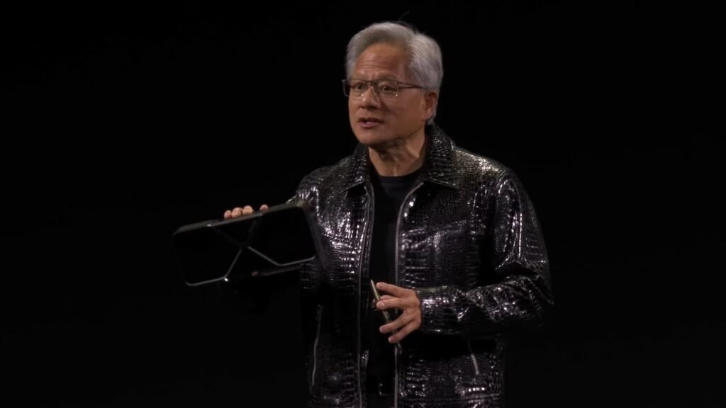 CEO Jensen Huang holding a GPU